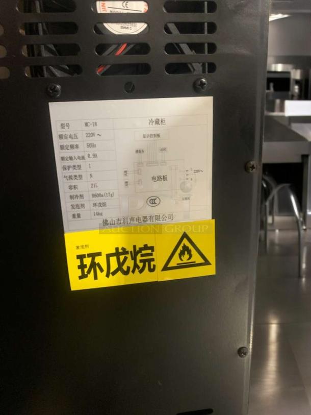Refined condition MC-18 glass-door cooler by Foshan KESN, 220V, tested, features safety and electrical diagram labels.