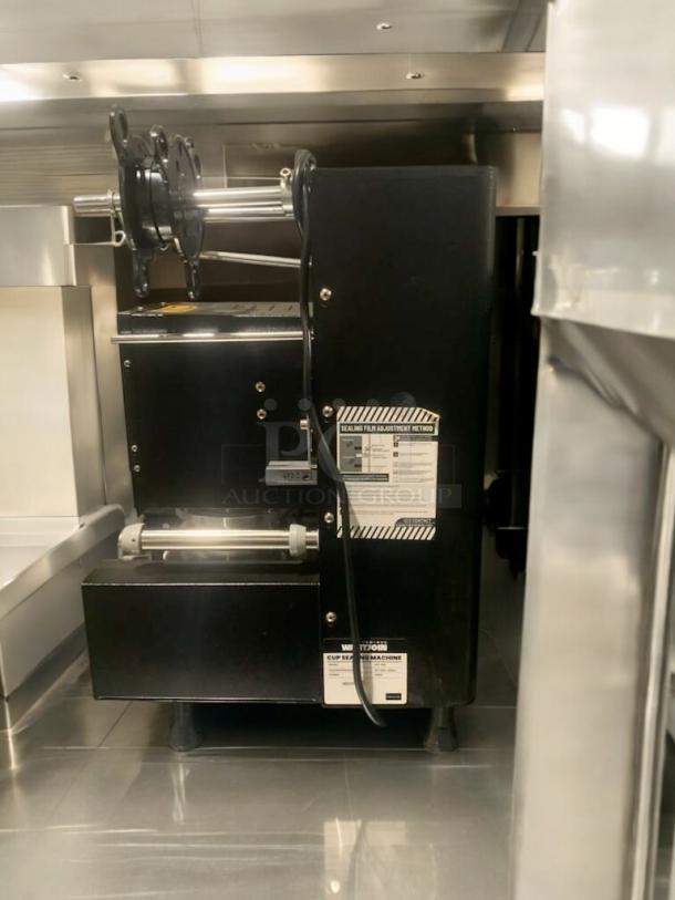 WantJoin WZ-95B automatic cup sealing machine in optimal condition, fully tested, 110-120V, black, visible labels.