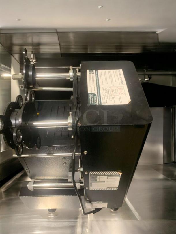 WantJoin WZ-95B automatic cup sealing machine, optimal condition, fully tested, 110–120V, visible operational instruction label.