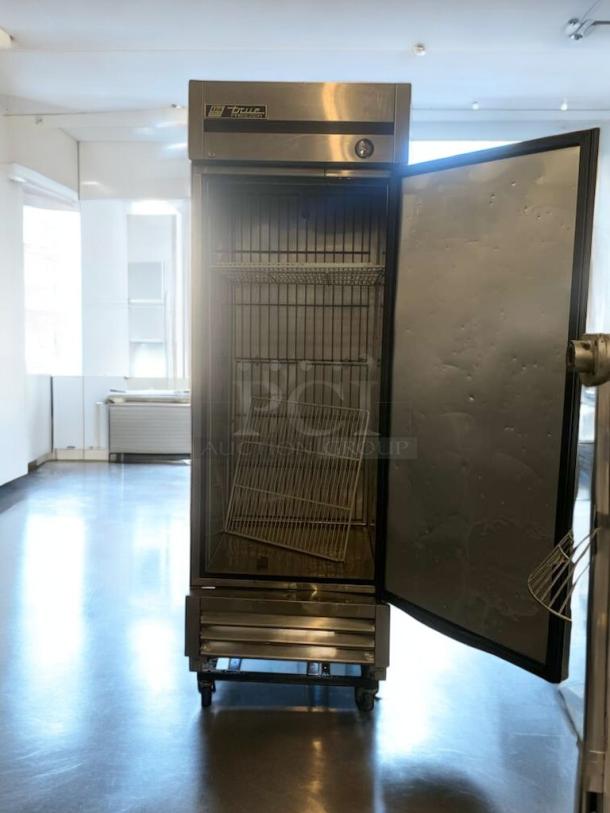 TRUE T-23F single door commercial freezer, superior condition, 115V, fully tested, open door, shelves inside, stainless steel exterior.