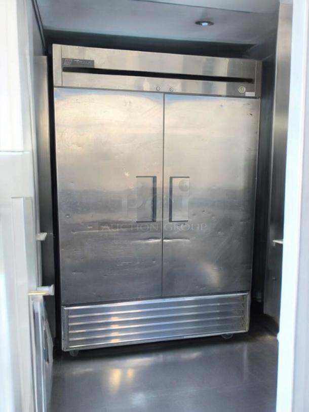 TRUE T-49F two-door commercial freezer, outstanding condition, stainless steel, 115V, fully tested, labeled with brand.
