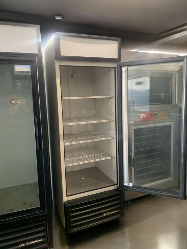 True GDM-23 commercial refrigerator, single glass door, 115V, fully tested, excellent condition, open with visible shelves.