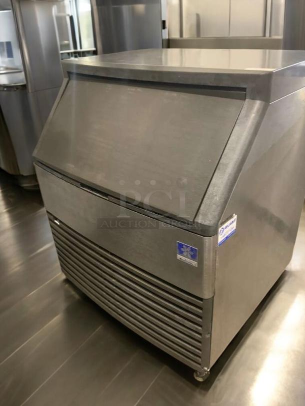 Manitowoc QD0272A ice maker with storage bin, stainless steel, 115V, fully tested, outstanding condition, visible manufacturer label.