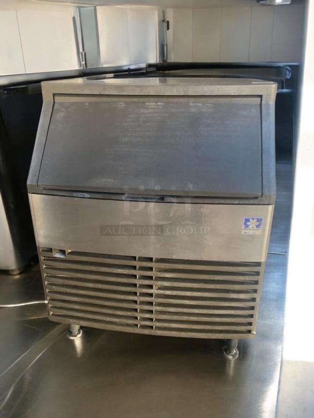 Manitowoc QD0272A ice maker with storage bin, 115V, stainless steel, fully tested, outstanding condition, visible brand label.