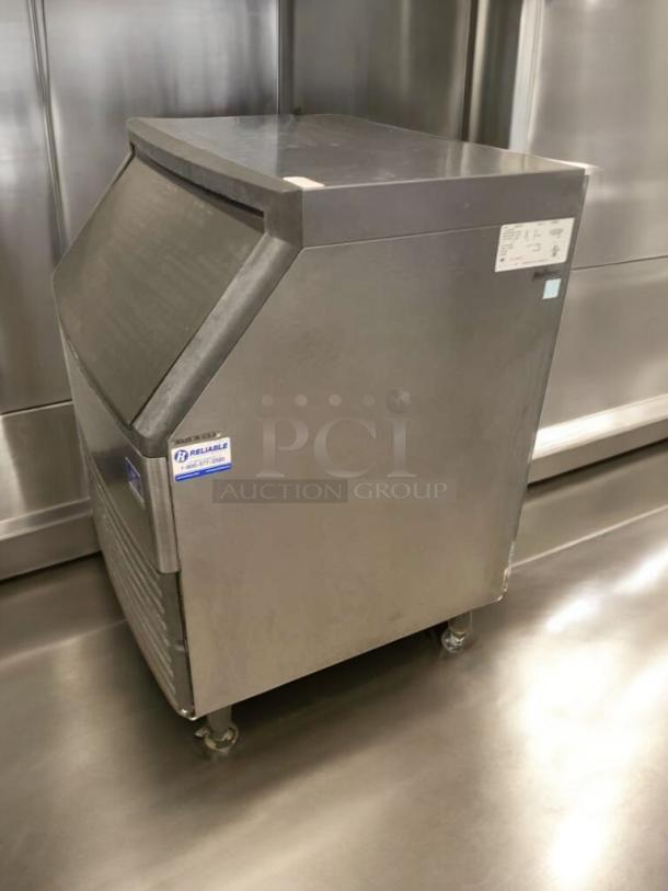 Manitowoc QD0272A ice maker with storage bin in outstanding condition, 115V, fully tested and working, on wheeled base.