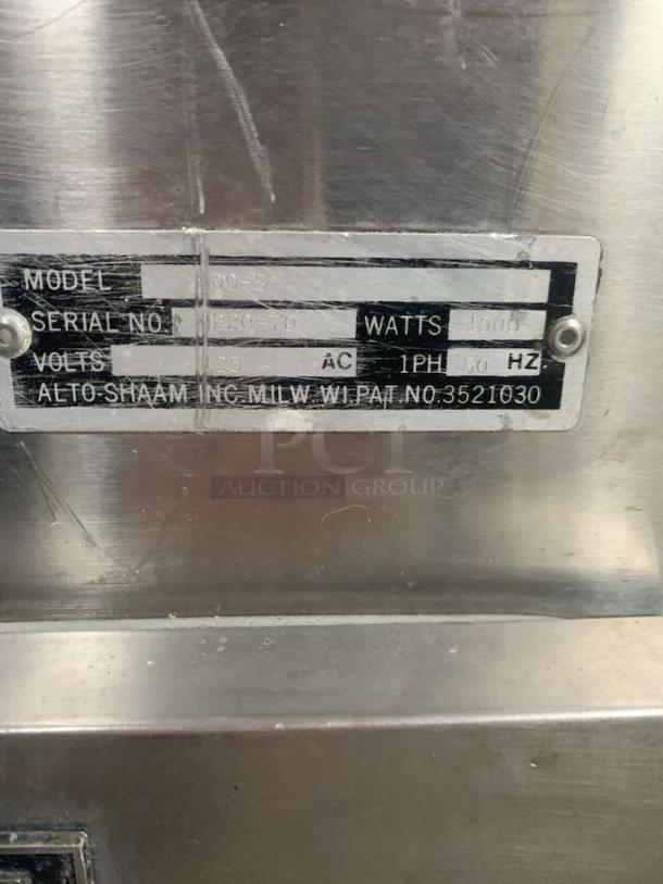 Alt text: Alto-Shaam 100-S Low-Temp Holding Cabinet label; 120V, 1000W, Model 100-S, Serial No. 10820-001, in great condition.