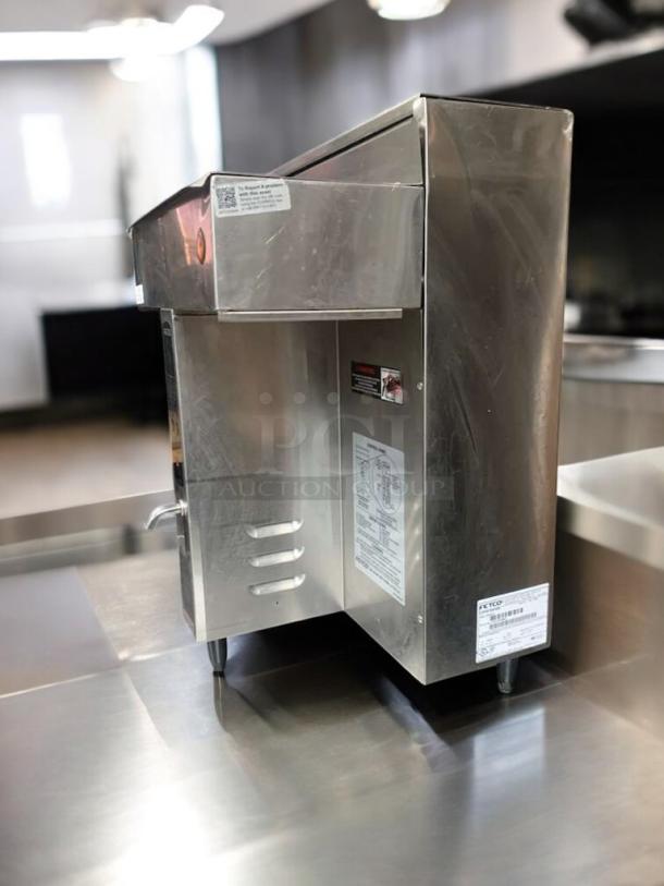 FETCO CBS-2032e commercial coffee brewer in outstanding condition, stainless steel finish, fully tested, with visible labels.