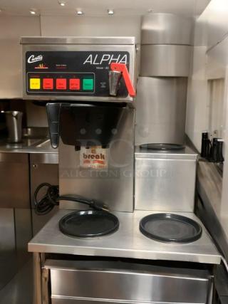 Gently used Curtis ALPHA 3DR-10 commercial coffee brewer. Features three burners, model labels, and working power cord.