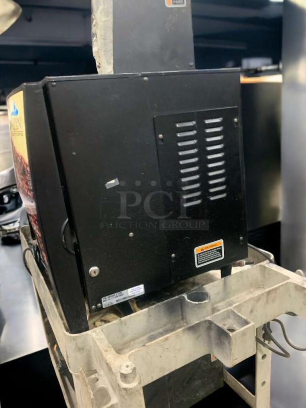 BUNN LCA-2 LP Ambient Liquid Coffee Dispenser, 120V, fully tested, black, excellent condition, manufacturer labels visible.