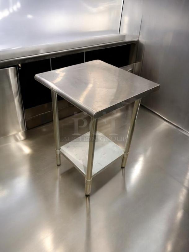 Heavy-duty stainless steel prep stand in prime condition, featuring a durable top and lower shelf, fully tested and ready.