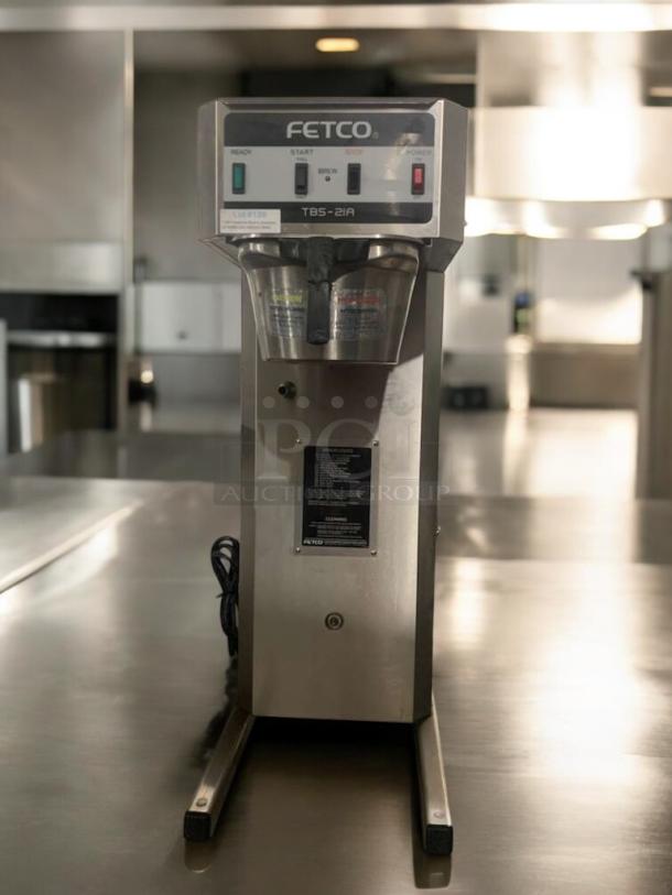 Fetco TBS-21A commercial tea brewer in great condition, 120V, fully tested. Features control panel, labels indicating brew status.