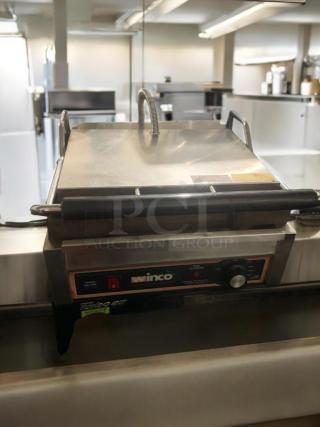 Winco EPG-1C commercial panini grill in great condition, featuring a stainless steel body and control knob, fully tested and working.