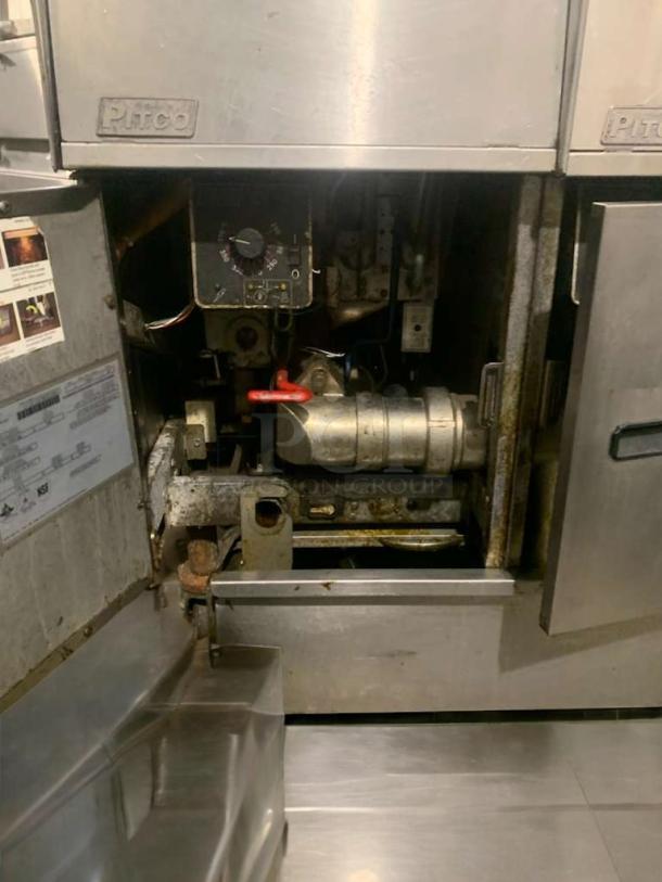 Pristine Pitco SG14 natural gas twin-tank deep fryer. Fully tested, excellent condition. Interior view showing controls and mechanism.