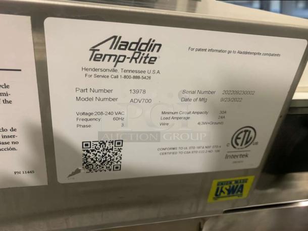 Aladdin Temp-Rite ADV700 meal delivery system label, serial number 202209230002, voltage 208–240VAC, tested and working.