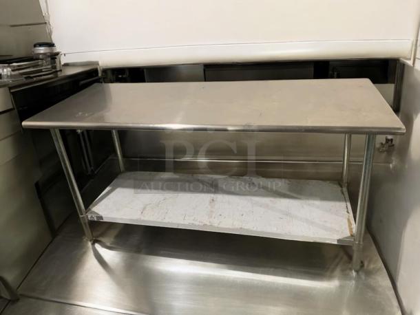 Stainless steel commercial work table, heavy duty, exceptional condition, with lower shelf, fully ready for use.