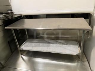 Stainless steel commercial work table, heavy duty, exceptional condition, with lower shelf, fully ready for use.