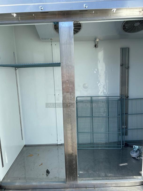 Kintera KBM3R 3-door bottom mount reach-in refrigerator, great condition, with shelving and cooling fans visible.