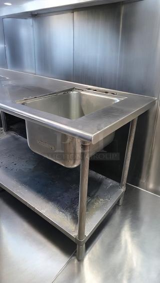 Top-tier stainless steel work table with integrated sink and can opener mount, 72"x30"x40", custom commercial fabrication, tested and clean.