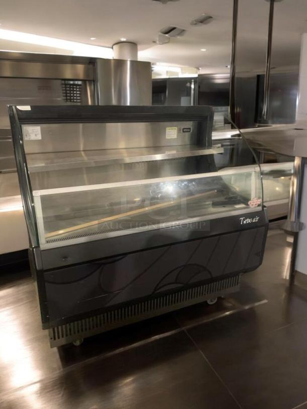 Turbo Air TOM-50LB open air refrigerated merchandiser, pristine condition, fully tested, 120V, sleek black design.