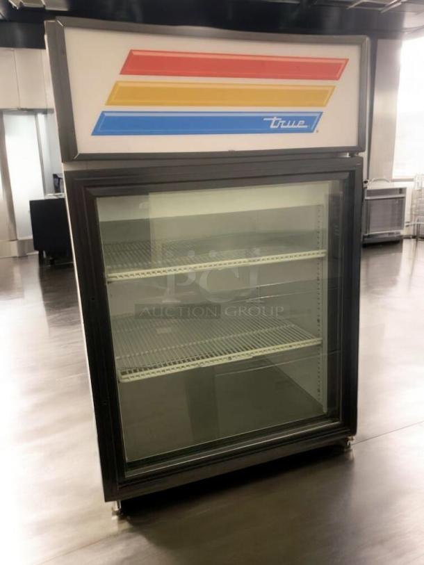 Pristine True GDM-05-LD glass door merchandiser, 115V, fully tested, with multicolor stripe logo, excellent condition.