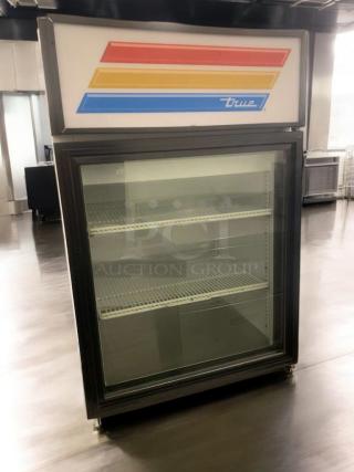 Pristine True GDM-05-LD glass door merchandiser, 115V, fully tested, with multicolor stripe logo, excellent condition.
