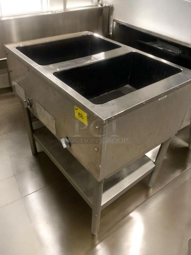 Eagle Waterless Hot Food Table, double well, gas, prime condition, fully tested, stainless steel, model details visible.