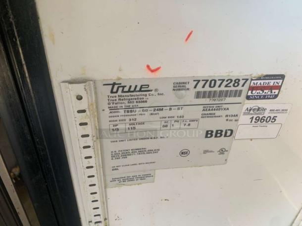 True TSSU-60-24M-B-ST refrigerated prep table label showing model, serial number 7707287, and "Made in USA" marking.