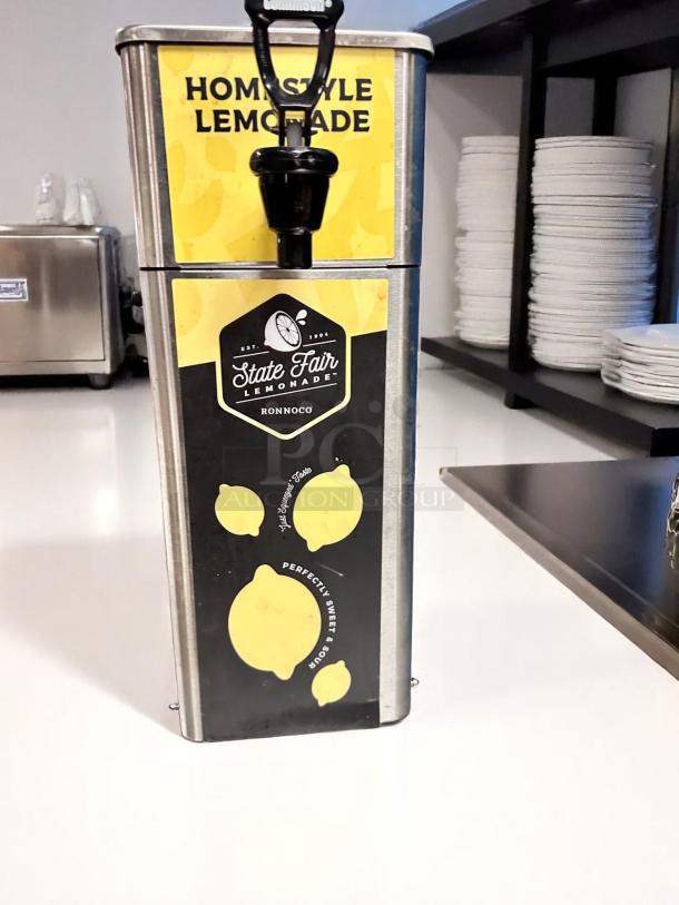 Newco FPM-1 stainless steel cold beverage dispenser, homestyle lemonade label, excellent condition, tested and working.