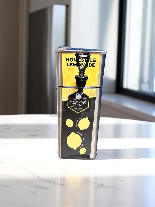 Newco FPM-1 stainless steel cold beverage dispenser, manual pour, excellent condition, “Homestyle Lemonade” label, fully tested.