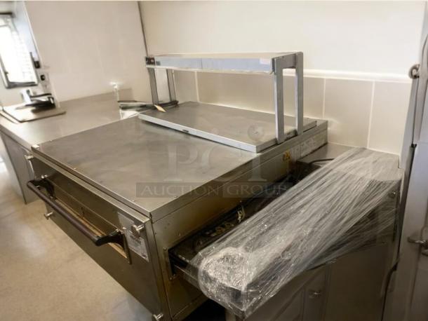 XLT 3255 conveyor pizza oven in exceptional condition, natural gas, fully tested, stainless steel, covered in protective wrap.