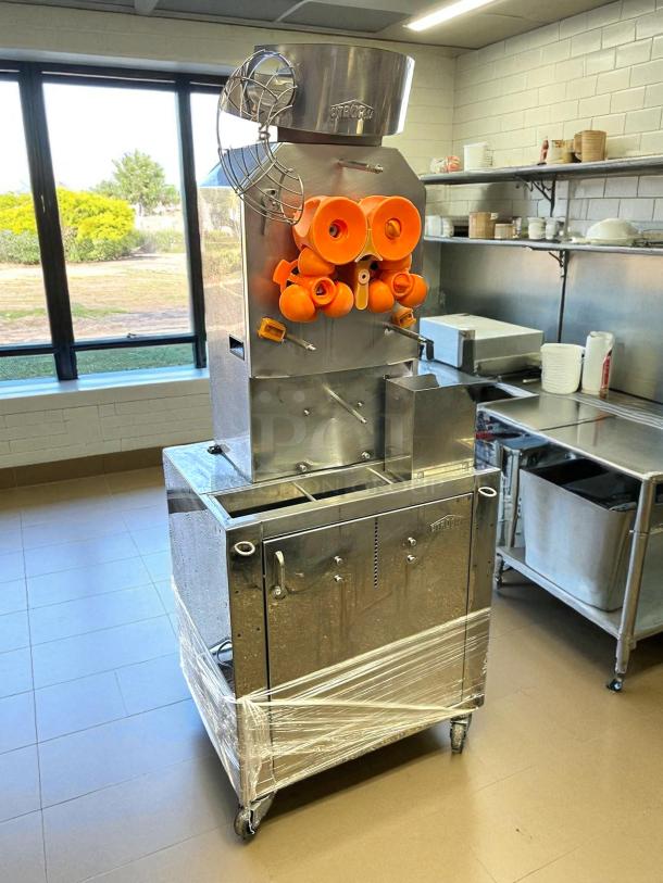 Citrocasa 8000 SB-ATS citrus juicer in superb condition, fully tested, 115V, stainless steel, orange components, wrapped base.