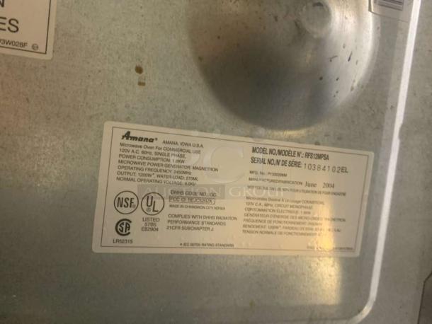 Amana RFS12MPA commercial microwave oven label showing model, serial number, NSF and UL certification. Made in 2004.