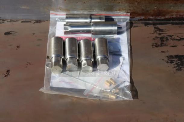 Bag of metal components and connectors for Cooking Performance Group GM-CPG-60-NL griddle, likely used for assembly.