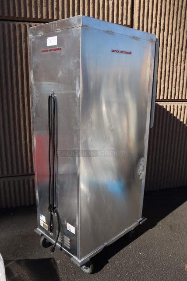 Brand new Avantco HTI-1836DS heated holding cabinet with solid Dutch doors, 120V, 1,575W, slight dents visible.