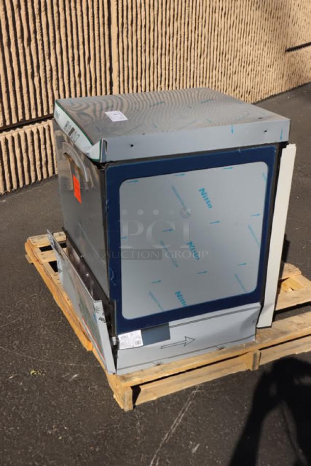 Brand new Noble Warewashing HT-UC24 undercounter dishwasher on a pallet, with visible scratch-n-dent condition.