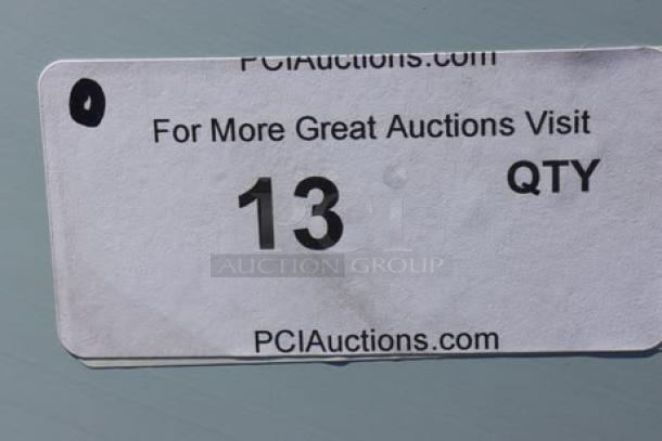 Sticker with "PCI Auctions," quantity "13," and website URL, indicating auction details.