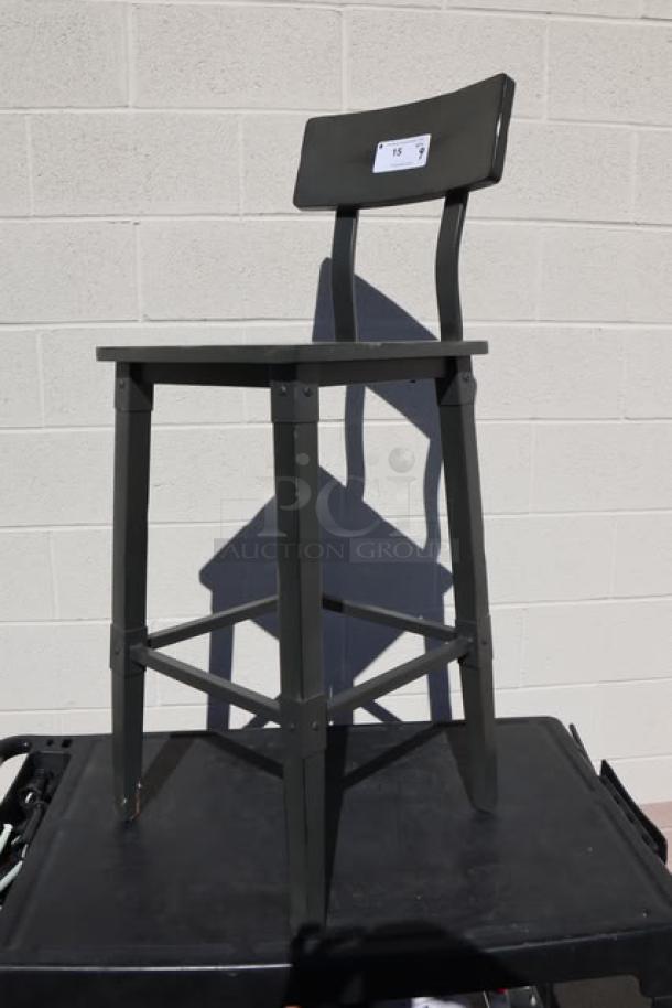 Brand new scratch-n-dent bar height wood stool with back and footrest. Minimal wear, sold as 9x your bid. Label shows number 15.