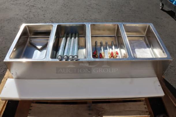 BRAND NEW ServIt EST-4WS four-pan electric steam table, 120V, 2000W, stainless steel, minor scratches and dents, adjustable undershelf.