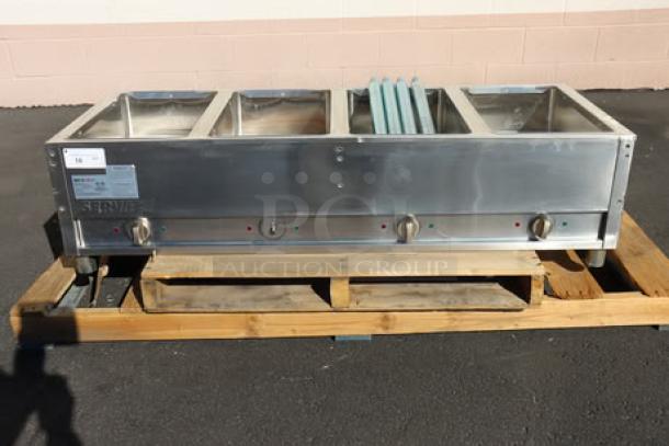BRAND NEW ServIt EST-4WS Four Pan Electric Steam Table, minor scratches, dents, with adjustable undershelf, 120V, 2000W.