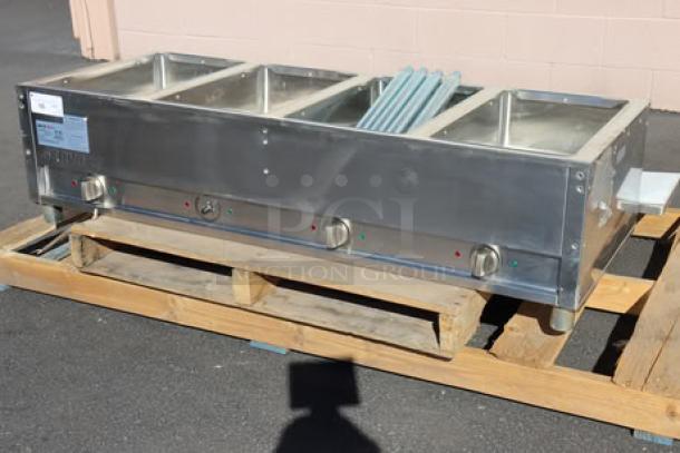 BRAND NEW ServIt EST-4WS four-pan electric steam table, stainless steel. Slight scratching/denting. Serial No: 2024061508004.