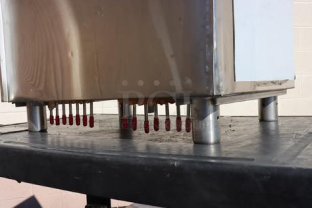 Regency 600IB1824CP underbar ice bin with 7 circuit cold plate, brand new with minor scratches. Features sturdy legs and bottle holders.