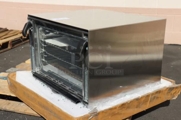 Brand new Vollrath CO4-120HS half size countertop convection oven, 120V, stainless steel, minor dents, S/N: P060-38577906-016.