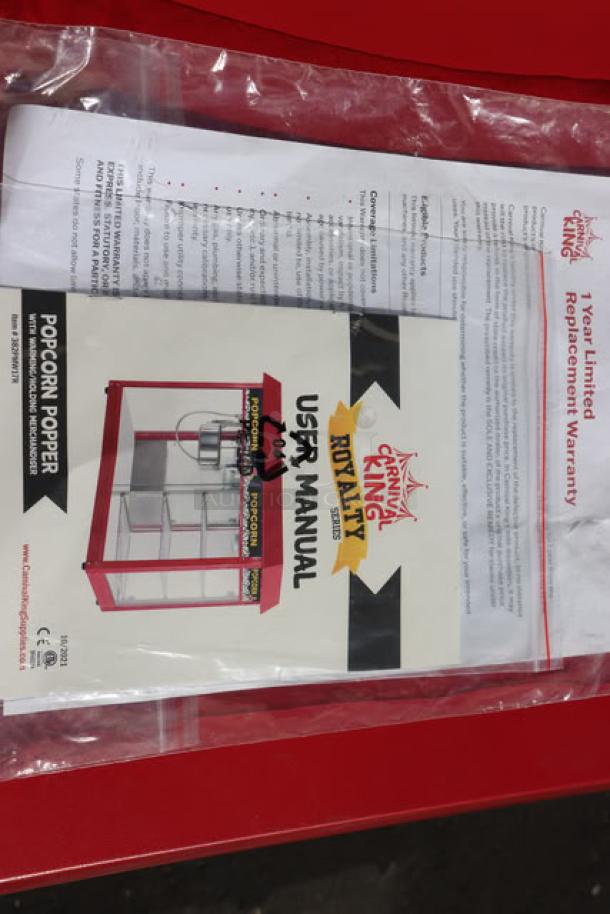 Carnival King PMW17R popcorn machine manual and warranty in a sealed bag, featuring usability instructions and 1-year warranty details.