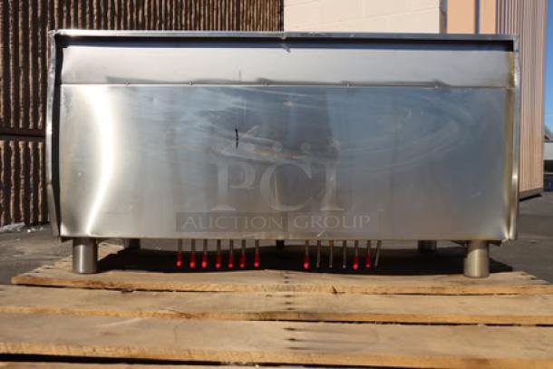 Brand new Regency 600IB1836CP 18"x36" underbar ice bin with cold plate, bottle holders; minor scratches visible.