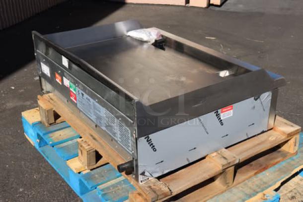Brand new Avantco CAG-36-TG 36" countertop gas griddle, thermostatic controls, 105,000 BTU, on pallet, out of packaging.