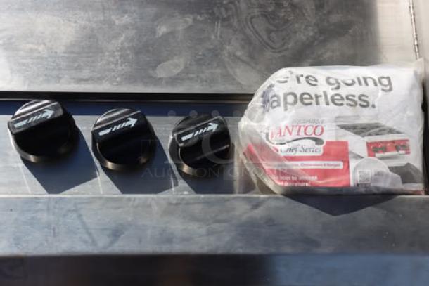 Avantco CAG-36-TG gas griddle, 36" countertop model, with thermostatic controls. Serial number 1401941000004. Out of packaging.