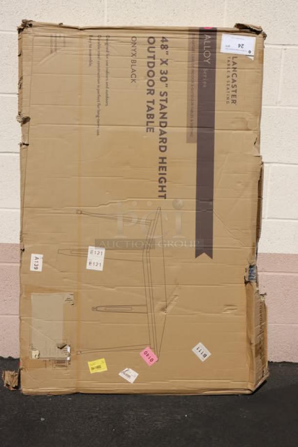 Brand new Lancaster Table & Seating 164RD304BLK outdoor table; 48"x30", onyx black, original packaging damaged with potential scratches.