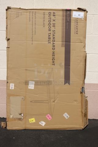 Brand new Lancaster Table & Seating 164RD304BLK outdoor table; 48"x30", onyx black, original packaging damaged with potential scratches.