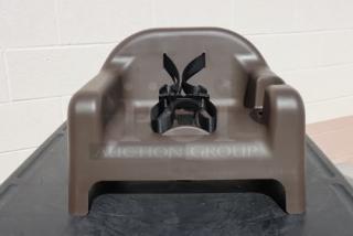 Brand new Carlisle 911401 brown polypropylene booster seat with safety strap. Durable and secure for child seating.