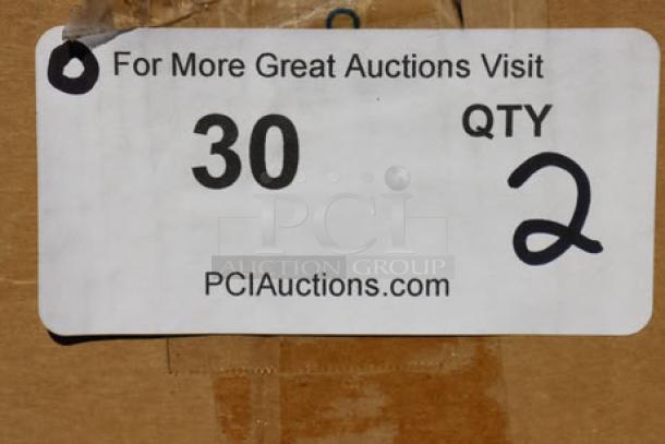 Alt text: Brown cardboard box with a label showing "QTY 2" and "PCIAuctions.com". Contains Carlisle 911401 booster seat.